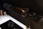 Wall shelf with lighting underneath. Ideal light above kitchen worktop. Floating wall shelf in gold. From Strackk. Top view