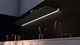 Wall shelf with lighting underneath. Perfect above kitchen countertop. Floating wall shelf in Gun Metal. From Strackk. Zoomed in bottom view