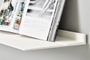 Wall shelf by Strackk White shelf with open book in ledge 1280 x 660 pxl