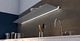 Wall shelf with lighting under Shelf in gunmetal above kitchen sink From Strackk Bottom view zoomed in 1280 x 660 pxl